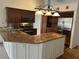 Kitchen boasts ample counter space, stainless steel appliances, and wooden cabinets at 4538 Hamlets Grove Dr, Sarasota, FL 34235