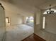 Bright living room featuring arched windows and chandelier at 4538 Hamlets Grove Dr, Sarasota, FL 34235