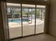 View of the screened-in pool and patio area at 4538 Hamlets Grove Dr, Sarasota, FL 34235