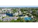 Beautiful aerial view of a community with a pond, tennis courts, and a pool at 4802 51St W St # 319, Bradenton, FL 34210
