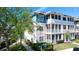 Inviting multi-story condo building with screened balconies, lush landscaping, and views of the adjacent pond at 4802 51St W St # 319, Bradenton, FL 34210