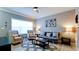 Bright living room with large window, futon, seating, and stylish decor at 4802 51St W St # 319, Bradenton, FL 34210
