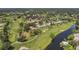 Scenic aerial view of a golf course community with ponds and lush landscaping at 5042 Marsh Field Rd # 16, Sarasota, FL 34235