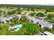 An aerial view showcases the community's layout, lush landscaping, community pool, and surrounding golf course, with nearby lakes at 5042 Marsh Field Rd # 16, Sarasota, FL 34235