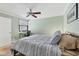 Bedroom with ceiling fan and a window view for natural light at 5042 Marsh Field Rd # 16, Sarasota, FL 34235