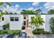 A well-maintained building with a brick-paved entryway and neatly landscaped surroundings, inviting guests and residents alike at 5042 Marsh Field Rd # 16, Sarasota, FL 34235