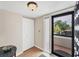 A welcoming foyer with tile flooring, a large closet, and natural light filtering through a secure storm door at 5042 Marsh Field Rd # 16, Sarasota, FL 34235