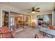 Enclosed porch area with open view to dining room and living room at 5042 Marsh Field Rd # 16, Sarasota, FL 34235