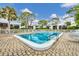 A refreshing community pool surrounded by lush landscaping and comfortable lounge chairs, perfect for relaxation and recreation at 5042 Marsh Field Rd # 16, Sarasota, FL 34235