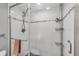 Close up of modern shower with built in shelving and a towel rack at 5042 Marsh Field Rd # 16, Sarasota, FL 34235