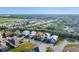 Expansive aerial view showcasing numerous homes and the surrounding lush green landscape at 5203 Title Row Dr, Bradenton, FL 34210