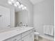Bright bathroom featuring a single vanity with quartz countertops, a shower and modern fixtures at 5203 Title Row Dr, Bradenton, FL 34210