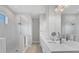 Bright bathroom featuring a glass shower, dual vanity with quartz countertops, and modern fixtures at 5203 Title Row Dr, Bradenton, FL 34210