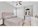 Bedroom featuring a comfy queen-size bed, ceiling fan, and closet at 5203 Title Row Dr, Bradenton, FL 34210