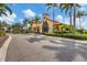 Exterior of a community building featuring a tile roof and manicured landscaping at 5203 Title Row Dr, Bradenton, FL 34210