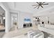 Open-concept living room with modern decor, seamlessly connecting to the kitchen and dining areas at 5203 Title Row Dr, Bradenton, FL 34210