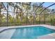 Covered pool with view of the yard at 5203 Title Row Dr, Bradenton, FL 34210