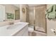 Modern bathroom with glass shower, brushed fixtures and tiled shower at 5307 Senza Trl, Palmetto, FL 34221