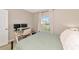 This bedroom features a large window with a glass computer desk, bathed in natural light at 5307 Senza Trl, Palmetto, FL 34221
