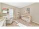 Calming Bedroom with natural light, a rocking chair, and a cozy crib at 5307 Senza Trl, Palmetto, FL 34221
