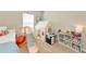 Bright bedroom with toys, a slide, play kitchen and cozy play tent at 5307 Senza Trl, Palmetto, FL 34221