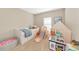 Spacious bedroom featuring toys, a slide, and plenty of room to play at 5307 Senza Trl, Palmetto, FL 34221