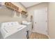 Laundry room featuring new appliances and convenient storage shelves at 5307 Senza Trl, Palmetto, FL 34221
