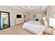 A serene bedroom with a tray ceiling, dresser, and carpet, offering a relaxing retreat at 5307 Senza Trl, Palmetto, FL 34221
