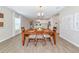 Dining area offers a view of the kitchen in the open-concept living space at 5307 Senza Trl, Palmetto, FL 34221