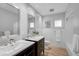 Bright bathroom featuring double vanity sinks, subway tile, and ample natural light for a clean and modern feel at 577 Corwood Dr, Sarasota, FL 34234