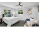 Serene bedroom with calming white walls, ample natural light, and a cozy seating area for relaxing at 577 Corwood Dr, Sarasota, FL 34234