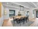 Spacious dining area featuring a unique wood table, stylish decor, and natural light, adjacent to the home office at 577 Corwood Dr, Sarasota, FL 34234