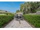 Driveway with shed and parked jetskis on a trailer at 577 Corwood Dr, Sarasota, FL 34234