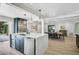 Stylish kitchen with an island, modern appliances, and open layout connecting to the dining area at 577 Corwood Dr, Sarasota, FL 34234