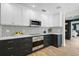 Contemporary kitchen with custom cabinetry, mosaic backsplash, and stainless steel appliances at 577 Corwood Dr, Sarasota, FL 34234