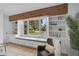 Bright living room features a window seat with storage and custom built-ins at 577 Corwood Dr, Sarasota, FL 34234