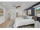 Beautiful main bedroom with light colored walls, white ceiling, and a view of the backyard at 577 Corwood Dr, Sarasota, FL 34234