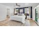 Bright main bedroom boasts ensuite bath, ceiling fan, and patio access at 577 Corwood Dr, Sarasota, FL 34234
