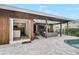 Inviting outdoor patio area with convenient access to the kitchen and luxurious poolside relaxation at 577 Corwood Dr, Sarasota, FL 34234