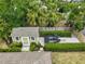 Aerial view of a shed surrounded by trimmed hedges with a personal watercraft parked nearby at 577 Corwood Dr, Sarasota, FL 34234