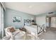 Comfortable bedroom featuring a cozy armchair and a quaint wrought iron bed frame, creating a relaxing retreat at 7461 W Country Club N Dr # 207, Sarasota, FL 34243