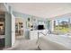 Serene bedroom boasting serene blue walls, large windows, and carpeted floors at 7461 W Country Club N Dr # 207, Sarasota, FL 34243