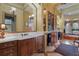 Spacious primary bathroom with dual sinks, custom cabinets, and a soaking tub at 7580 Preservation Dr, Sarasota, FL 34241