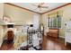 Bedroom with hardwood floors, ceiling fan, natural light, and comfortable furniture at 7580 Preservation Dr, Sarasota, FL 34241