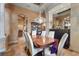 Elegant dining room features a wood table, chandelier, and decorative display cabinet, offering a sophisticated space at 7580 Preservation Dr, Sarasota, FL 34241