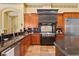 Gourmet kitchen with custom cabinetry, granite countertops, and professional-grade appliances at 7580 Preservation Dr, Sarasota, FL 34241