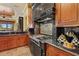 Beautiful kitchen with wood cabinets, granite countertops, stainless appliances, and decorative accents at 7580 Preservation Dr, Sarasota, FL 34241