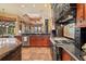 Gourmet kitchen with stainless steel appliances and a large island at 7580 Preservation Dr, Sarasota, FL 34241