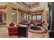 Bright living room with tile floors and ample seating, perfect for entertaining guests at 7580 Preservation Dr, Sarasota, FL 34241
