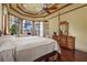 Bright bedroom with large windows, hardwood floors, and a comfortable king-sized bed at 7580 Preservation Dr, Sarasota, FL 34241